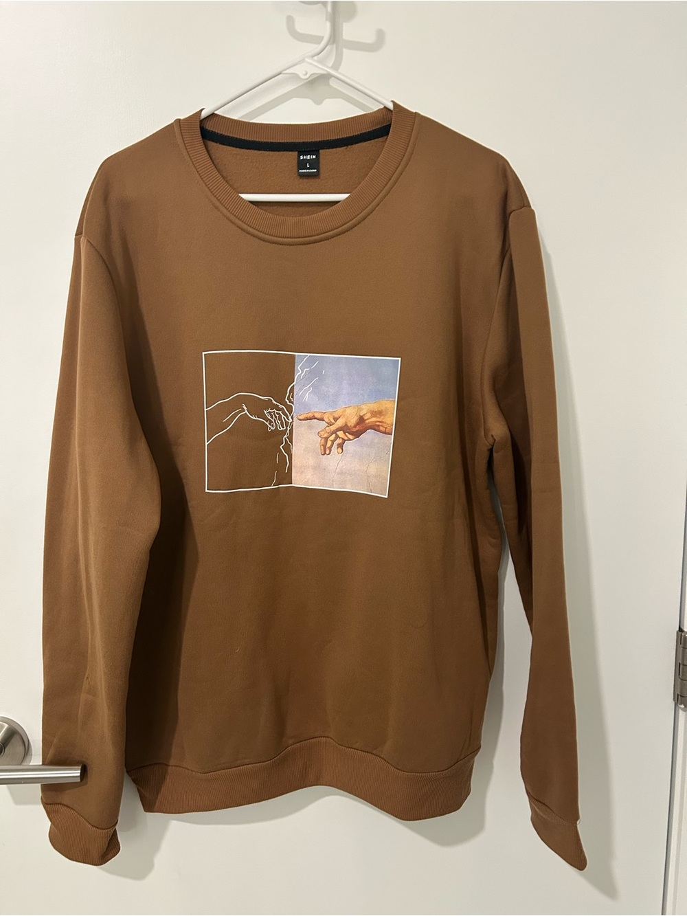 SHEIN Brown Crewneck Sweatshirt with Split Hand Graphic